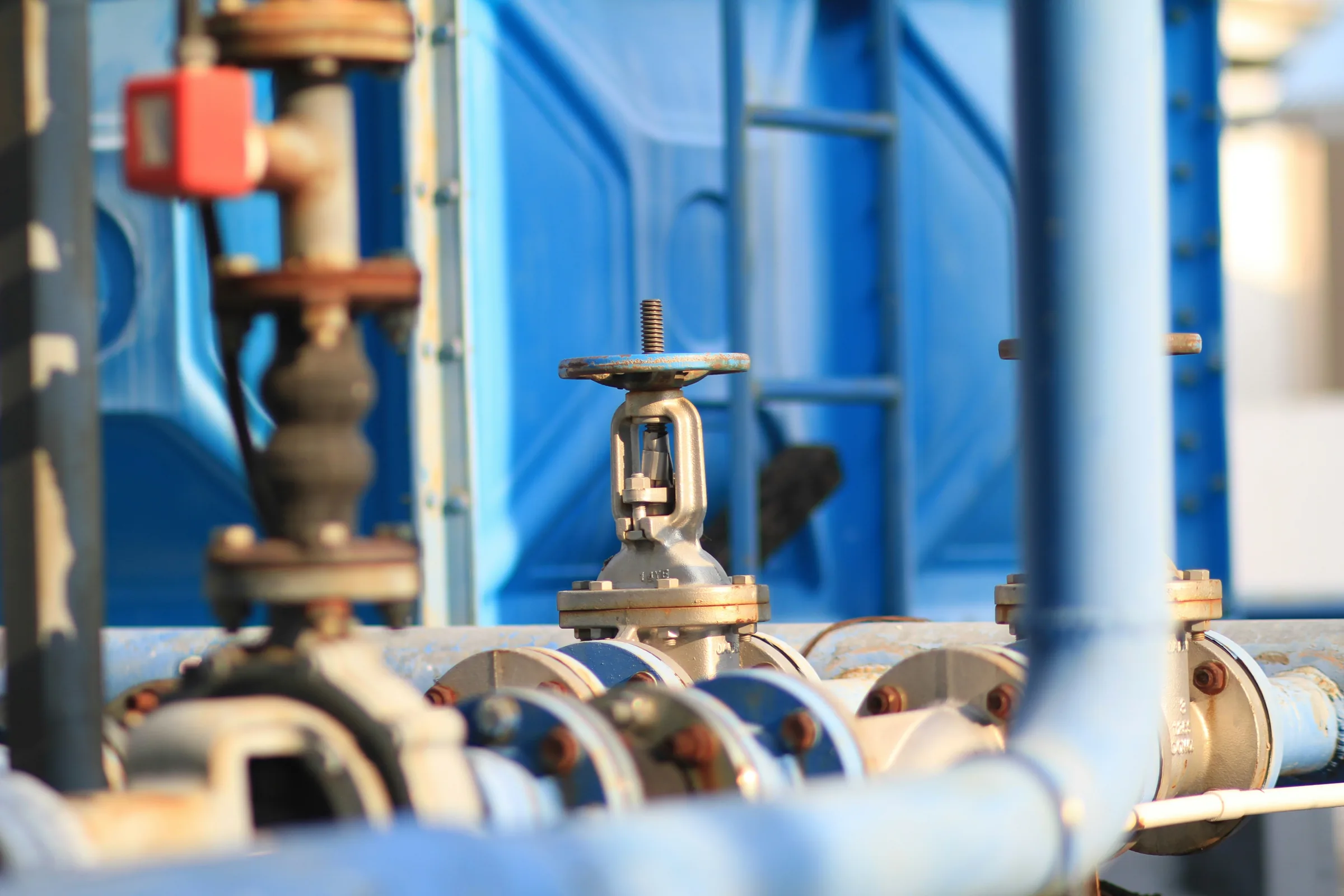 Close-up of industrial valves and pipework on a boiler skid